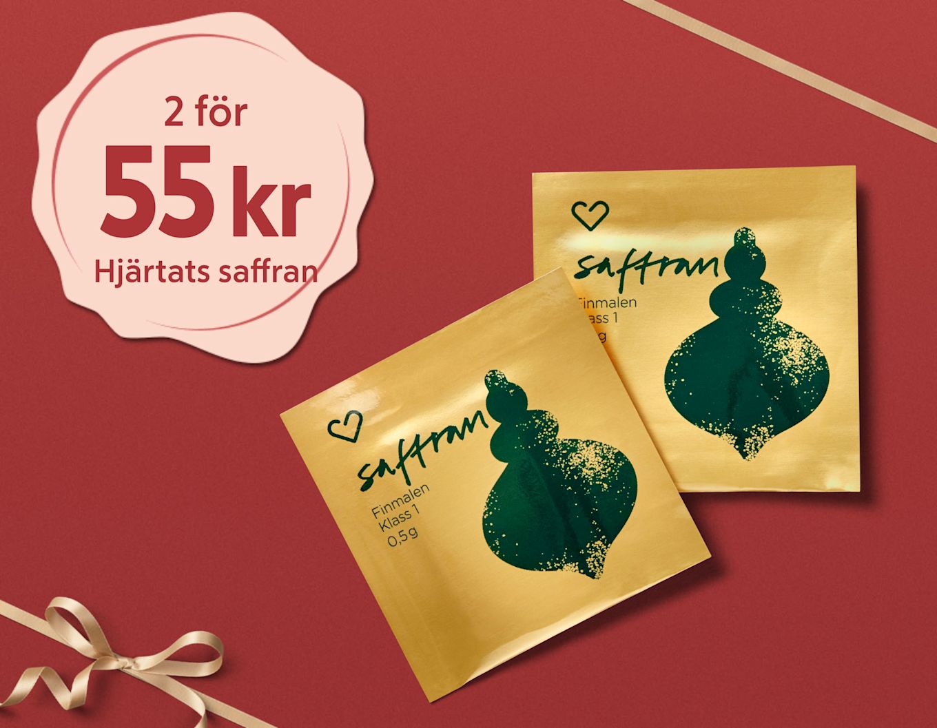 Två påsar saffran med grönt mönster på gul bakgrund, erbjudande 2 för 55 kr, ligger på röd bakgrund med gulddekoration.