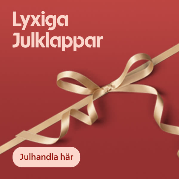 Gyllene sidenband knutet i rosett på röd bakgrund med texten Lyxiga Julklappar och knappen Julhandla här.